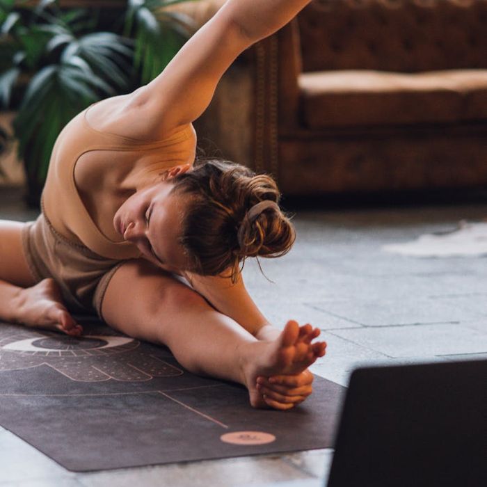 Person in a relaxed pose on a yoga mat.